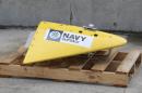 In this Sunday, March 30, 2014 photo, a towed pinger locator (TPL), used to detect black box recorders, sits on the wharf at naval base HMAS Stirling in Perth, Australia, ready to be fitted to the Australian navy ship Ocean Shield to aid in the search for missing Malaysia Airlines Flight MH370. Crews searching for the jet launched a targeted underwater hunt on Friday, April 4 for the plane's black boxes along a stretch of remote ocean, with just days left before the devices' batteries are expected to run out. The Ocean Shield, which is dragging the towed pinger locator from the U.S. Navy, and the British navy's HMS Echo, which has underwater search gear on board, will converge along a 240-kilometer (150-mile) track in a desolate patch of the southern Indian Ocean, said Angus Houston, the head of a joint agency coordinating the search. (AP Photo/Rob Griffith)