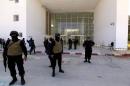 Tunisian police officers guard the entrance of the National Bardo Museum in Tunis