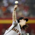 San Francisco Giants' Tim Lincecum releases a pitch against the Arizona Diamondbacks in the first inning of an MLB baseball game, Sunday, Sept. 25, 2011, in Phoenix. (AP Photo/Paul Connors)