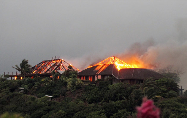 In this image  issued  Monday Aug. 22, 2011 by Virgin Limited Edition shows British entrepreneur's  Sir Richard Branson's luxury home, on Necker Island, in the Caribbean, in flames as a fire which rip