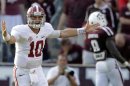 Alabama quarterback AJ McCarron (10) celebrates after throwing a touchdown pass to Jalston Fowler during the fourth quarter of an NCAA college football game against Texas A&M Saturday, Sept. 14, 2013, in College Station, Texas. Alabama won 49-42. (AP Photo/David J. Phillip)