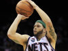 FILE - In this April 6, 2012, file photo, New Jersey Nets' Deron Williams (8) shoots during the first half of an NBA basketball game against the Washington Wizards in Newark, N.J. Williams said on his Twitter page, Tuesday, July 3, that he "made a very tough decision today" and posted a picture of the new team logo that accompanies the Nets' move from New Jersey to Brooklyn. A person with knowledge of the decision says Williams told the team Tuesday he was accepting their five-year contract worth $98 million. (AP Photo/Mel Evans, File)