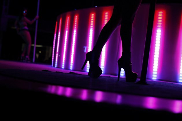 Exotic dancers perform during the Sex and Entertainment 2012 adult exhibition at the Palacio de los Deportes in Mexico City