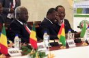 Sierra Leone's President Ernest Bai Koroma, Togo's President Faure Gnassingbe and Burkina Faso's President Blaise Compaore attend a summit on the crisis in Mali and Guinea Bissau, at the Fondation Felix Houphouet Boigny in Yamoussoukro