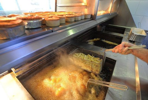 Chips are fried at a Fish and Chip Takeaway in Manchester