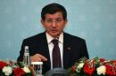 Turkish Prime Minister Ahmet Davutoglu gives a press conference on December 18, 2014 in Ankara