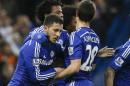Chelsea's Eden Hazard, left, celebrates scoring a goal during the English Premier League soccer match between Chelsea and Stoke City at Stamford Bridge stadium in London, Saturday, April 4, 2015. (AP Photo/Kirsty Wigglesworth)
