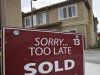 FILE - In this May 23, 2011 file photo, a sold sign is posted at a new town home luxury property at "Vistas at Indian Oaks," a Toll Brothers real state development in Chatsworth, Calif. Toll Brothers Inc. said Wednesday, Aug. 24, 2011, that its fiscal third-quarter net income rose 54 percent, partly helped by a higher tax benefit. But the nation's biggest luxury homebuilder narrowed its full-year home delivery outlook, as market conditions remain unstable. (AP Photo/Damian Dovarganes)