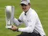 Justin Rose holds the BMW trophy after he won the final round at the BMW Championship golf tournament on Sunday, Sept. 18, 2011, in Lemont, Ill. Rose finished total 13 under. (AP Photo/Nam Y. Huh)