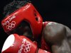 Essomba of Cameroon concentrates as he fights Danielyan of Armenia during their men's light flyweight (48kg) round of 32 boxing match at the Beijing 2008 Olympic Games