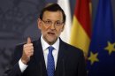 Spain's Prime Minister Mariano Rajoy gestures during a joint news conference with his Polish counterpart Donald Tusk at Moncloa Palace in Madrid