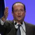 French Socialist Party candidate for the 2012 presidential elections Francois Hollande, gestures as he delivers a speech during a meeting in Aulnay-sous-Bois, a eastern suburb of Paris, Saturday, April 7, 2012. (AP Photo/Michel Euler)