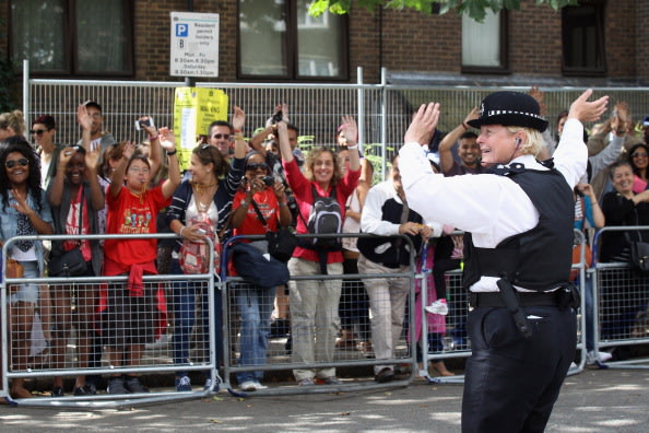 A police officer dances with …