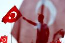 A man waves Turkey's national flag during the Democracy and Martyrs Rally in Istanbul