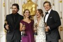 FILE - In this Feb. 27, 2011 file photo, Oscar winners, from left, Christian Bale, best supporting actor for his role in 