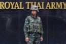 A Thai soldier stands guard outside the Royal Thai Army Headquarters as members of the Radio and Satellite Broadcasters gather in Bangkok