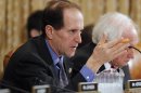 House Ways and Means Committee Chair Camp questions U.S. Secretary of the Treasury Geithner in Washington