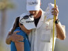 I.K. Kim, of South Korea, is consoled by her caddie, John Limanti, after missing the potential winning putt on the 18th hole during the final round of the Kraft Nabisco Championship golf tournament, Sunday, April 1, 2012, in Rancho Mirage, Calif. (AP Photo/Chris Carlson)