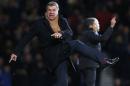 FILE - In this Tuesday, Feb. 11, 2014 file photo, West Ham United's manager Sam Allardyce kicks out as he shows his anger toward an assistant referee for a decision during their English Premier League soccer match against Norwich City at Upton Park, London. West Ham was on the crest of a wave mid-season, standing fourth in the table at Christmas time but a disastrous second half of the campaign – just three wins in the last 20 matches – has seen them drop to 11th. (AP Photo/Sang Tan, File)