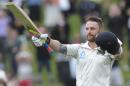 New Zealand's Brendon McCullum celebrates his triple century against India on the final day of the second test at the Basin Reserve in Wellington, New Zealand, Tuesday, Feb. 18, 2014. (AP Photo/SNPA, Ross Setford) NEW ZEALAND OUT