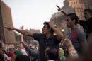 Men chant slogans against Egyptian President Mohammed Morsi during a demonstration supporting in Tahrir Square in Cairo, Egypt, Wednesday, June 26, 2013.(AP Photo/Manu Brabo)