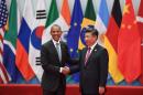China's President Xi Jinping (R) shaking hands with US President Barack Obama before the G20 leaders' family photo in Hangzhou on September 4, 2016