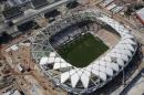 In this Dec. 10, 2013 photo, an aerial view of the Arena da Amazonia stadium in Manaus, Brazil. The construction firm building the Arena da Amazonia stadium which will host World Cup games in the jungle city of Manaus says a worker fell to his death Saturday from the stadium's roof structure. The Andrade Gutierrez company says Marcleudo Ferreira fell some 115 feet. (AP Photo/Renata Brito)