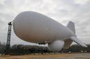 In this December 15, 2014 photo released by the US Army, personnel oversee the inflation of an aerostat Joint Land Attack Cruise Missile Defense Elevated Netted Sensor System (JLENS) at Aberdeen Proving Ground, Maryland