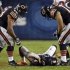 Bears quarterback Cutler lies on the field after being hit late on a play by the Houston Texans during the first half of their NFL football game at Soldier Field in Chicago