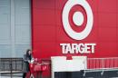 Shopper Laura Steele leaves a Target store in Toronto on Thursday, Jan. 15, 2015. More than 17,600 Target employees will eventually lose their jobs when the U.S. discount retailer closes its 133 Canadian stores after only about two years to end financial losses that went as high as a billion dollars a year. (AP Photo/The Canadian Press, Nathan Denette)