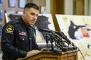 Omaha Police Chief Todd Schmaderer speaks in front of images from security video and an enlargement of an airsoft pistol used in the robbery of a Wendy's restaurant on Tuesday, during a news conference at police headquarters in Omaha, Neb., Wednesday, Aug. 27, 2014. Bryce Dion, a sound technician with the 