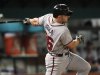 Atlanta Braves' Dan Uggla watches his fifth-inning single during a baseball game against the Florida Marlins in Miami, Tuesday, Aug. 9, 2011. (AP Photo/J Pat Carter)