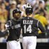 Colorado Rockies' Mark Ellis (14) is congratulated by Eric Young Jr. (1) after hitting a two run home run off San Diego Padres relief pitcher Cory Luebke during the sixth inning of a baseball game in Denver, Monday, Sept. 19, 2011. (AP Photo/Jack Dempsey)
