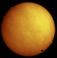 Paul Hyndman captured this stunning view of Venus crossing the face of the sun in hydrogen-alpha light on the morning of June 8, 2004 from Roxbury, Connecticut. He used an Astro-Physics 105-millimeter Traveler telescope fitted with a Coronado S