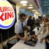 Customers buy a meal at a Burger King restaurant in Marseille-Provence airport, in Marignane, France, Saturday, Dec. 22, 2012. Fifteen years after leaving France, the U.S. hamburger chain Burger King returned with the opening of a restaurant in Marseille-Provence airport. (AP Photo/Claude Paris)