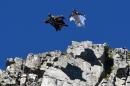 Two men leap in wingsuits on July 16, 2014, from the summit of Le Brevent, where a 39-year-old French soldier died December 26 attempting a similar flight in what is considered one of the most dangerous of extreme sports