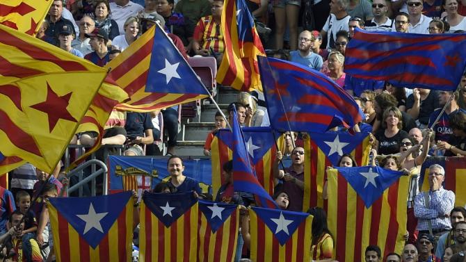 Barcelona&#39;s supporters wave &quot;Esteladas&quot; (Catalan pro independence flags) during the Spanish league football match FC Barcelona v UD Las Palmas at the Camp Nou stadium in Barcelona on September 26, 2015