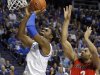 Kentucky's Terrence Jones, left, shoots in front of Georgia's Marcus Thornton during the first half of an NCAA college basketball game in Lexington, Ky., Thursday, March 1, 2012. (AP Photo/James Crisp)