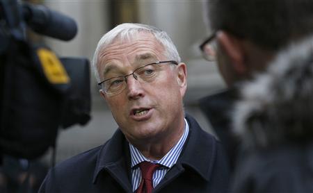Photo: Union Cycliste Internationale (UCI) President Pat McQuaid speaks to reporters as he leaves a procedural hearing in London January 25, 2013. REUTERS/Suzanne …