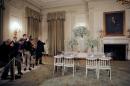 Photojournalists take pictures of set table during the preview of a state dinner where U.S. President Barack Obama will host five leaders of Nordic nations at a lavish state dinner at the White House on Friday, in Washington
