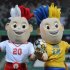 The two EURO2012 mascots wearing Ukraine (right) and Poland's national jerseys pose at the Legia stadium in Warsaw