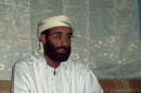 This October 2008 file photo shows Imam Anwar al-Awlaki in Yemen. A federal appeals court on Monday, June 23, 2014, released a previously secret memo that provided legal justification for using drones to kill Americans suspected of terrorism overseas. The memo pertained specifically to the September 2011 drone-strike killing in Yemen of Anwar Al-Awlaki, an al-Qaida leader who had been born in the United States. (AP Photo/Muhammad ud-Deen, File)