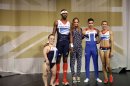 British athletes, from left, paralympic swimmer Eleanor Simmonds, triple jumper Phillips Idowu, gymnast Louis Smith and heptathlete Jessica Ennis pose for photographers with designer Stella McCartney, center, in front of a depiction of the British Union Flag during the launch of the team kit that will be worn by British athletes at the London 2012 Olympic and Paralympic Games at the Tower of London in London, Thursday, March 22, 2012. The kit unveiled Thursday, was designed by British fashion designer Stella McCartney. (AP Photo/Matt Dunham)