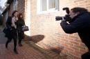 Italian sisters Elisabetta (L) and Francesca Grillo, former assistants of Nigella Lawson and Charles Saatchi, arrive at Isleworth Crown Court in west London, on November 28, 2013