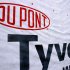 The Dupont logo is displayed on sheets of Tyvek insulation covering the outside wall of a home being built Monday, Jan. 23, 2012 in Springfield, Ill. The DuPont Co.'s fourth-quarter earnings dipped slightly on higher costs but topped Wall Street expectations.(AP Photo/Seth Perlman)