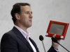 Republican presidential candidate, former Pennsylvania Sen. Rick Santorum holds an Etch A Sketch as he speaks to USAA employees during a campaign stop, Thursday, March 22, 2012, in San Antonio. (AP Photo/Eric Gay)