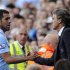 Manchester City's coach Mancini substitutes Tevez during their English Premier League soccer match against Wigan Athletic in Manchester