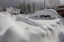 A car is buried in snow after a heavy winter storm in Incline Village, Nevada
