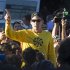 Lance Armstrong speaks to the crowd prior to a run with his fans at Mount Royal park in Montreal