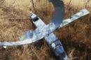 A still photograph used in a video shows a downed drone in Deliosman Village